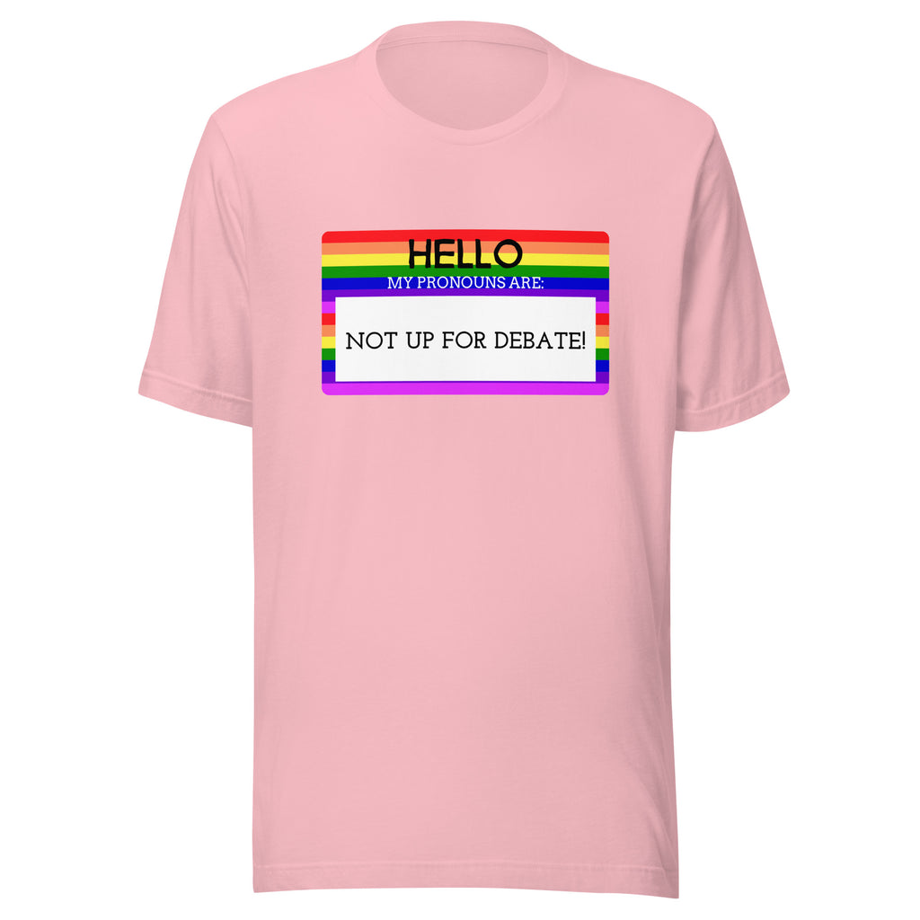 Light pink T-shirt with rainbow-striped name-tag graphic and bold text: HELLO MY PRONOUNS ARE: NOT UP FOR DEBATE!