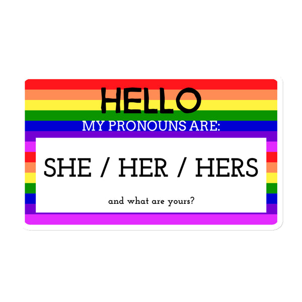 Magnet with a rainbow and purple border, reading “Hello My Pronouns Are She / Her / Hers”—queer, gender-affirming