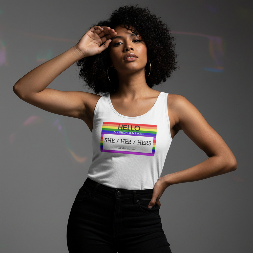 Unisex tank top reads "Hello My Pronouns Are She / Her / Hers"; curly-haired person poses