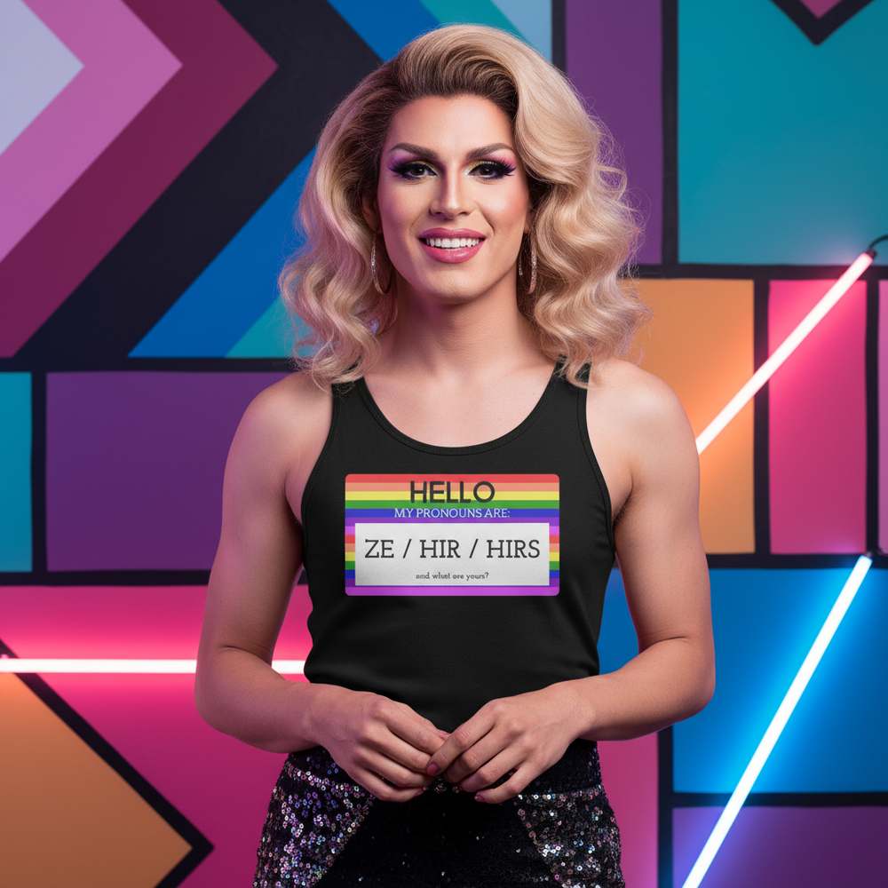 Unisex tank top with "Hello My Pronouns Are Ze / Hir / Hirs" rainbow name tag, worn by a smiling person, neon wall backdrop