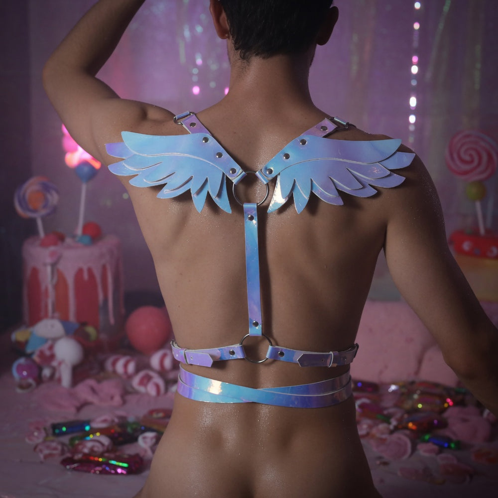 Rear view of a person wearing an iridescent harness with large angel wings