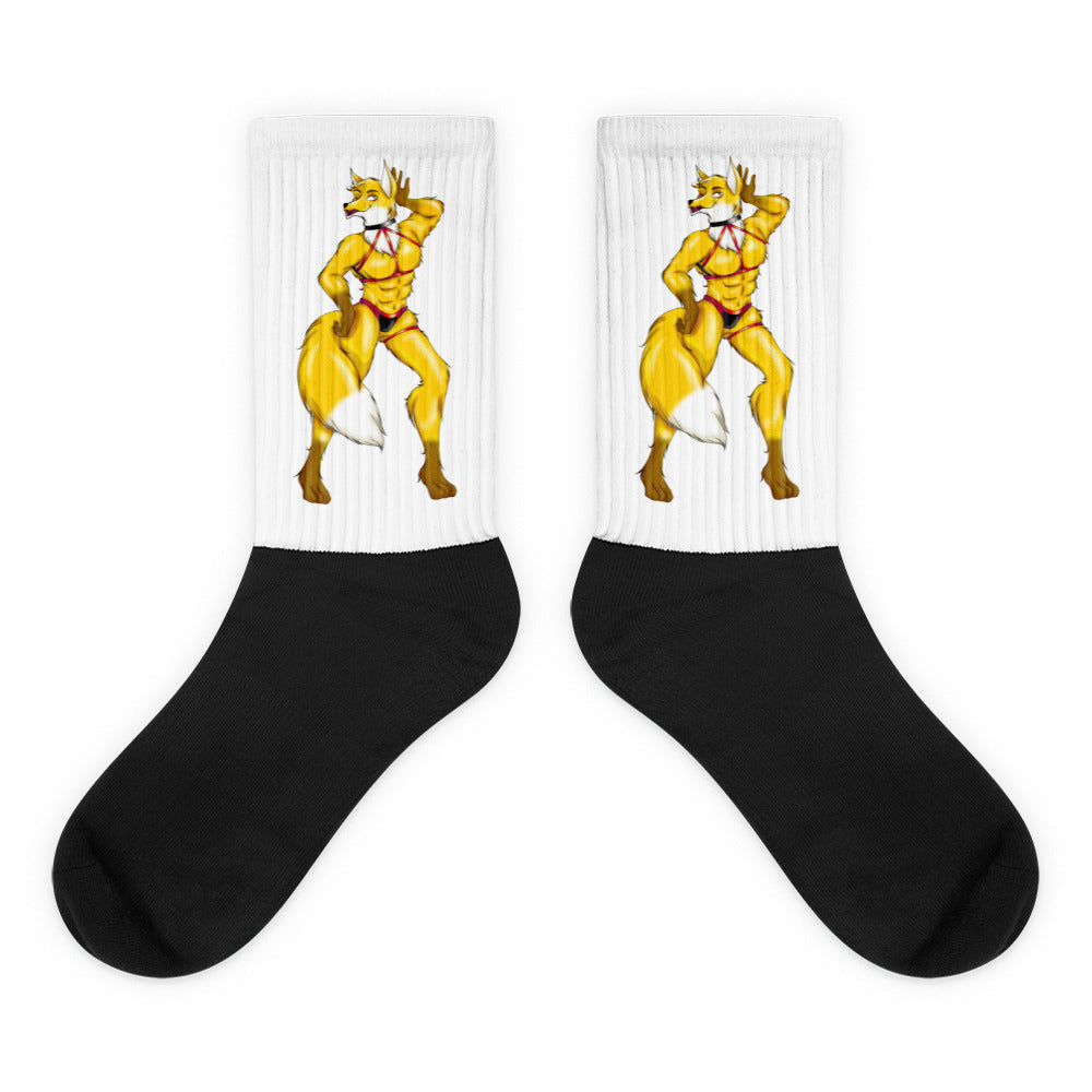 Pair of black-and-white crew socks featuring matching yellow furry characters in red briefs