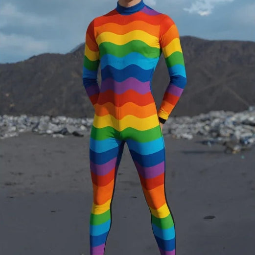 Front view of a person wearing a full-body rainbow-striped Pride bodysuit outdoors