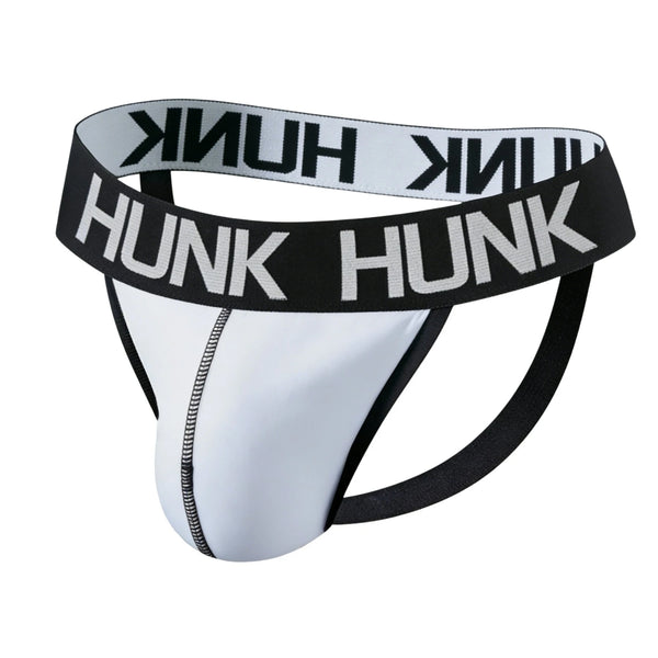Front three-quarter view of a white jockstrap with black HUNK waistband and straps