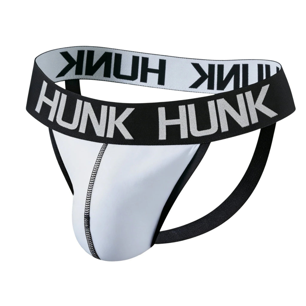 Front three-quarter view of a white jockstrap with black HUNK waistband and straps