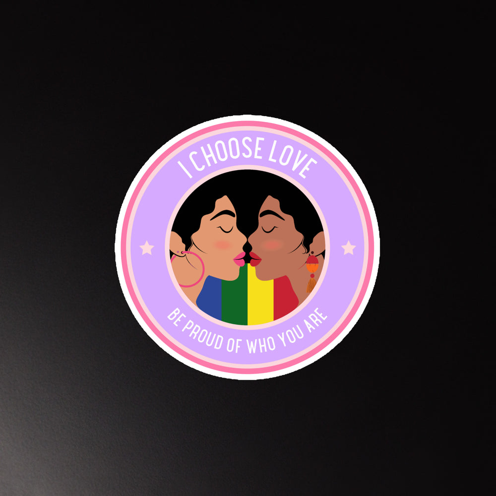 Round magnet reading “I CHOOSE LOVE” and “BE PROUD OF WHO YOU ARE,” with two women kissing