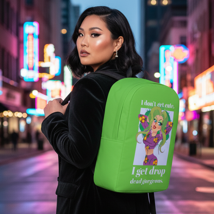 Bright green water-resistant backpack with "I Get Drop Dead Gorgeous," cartoon girl