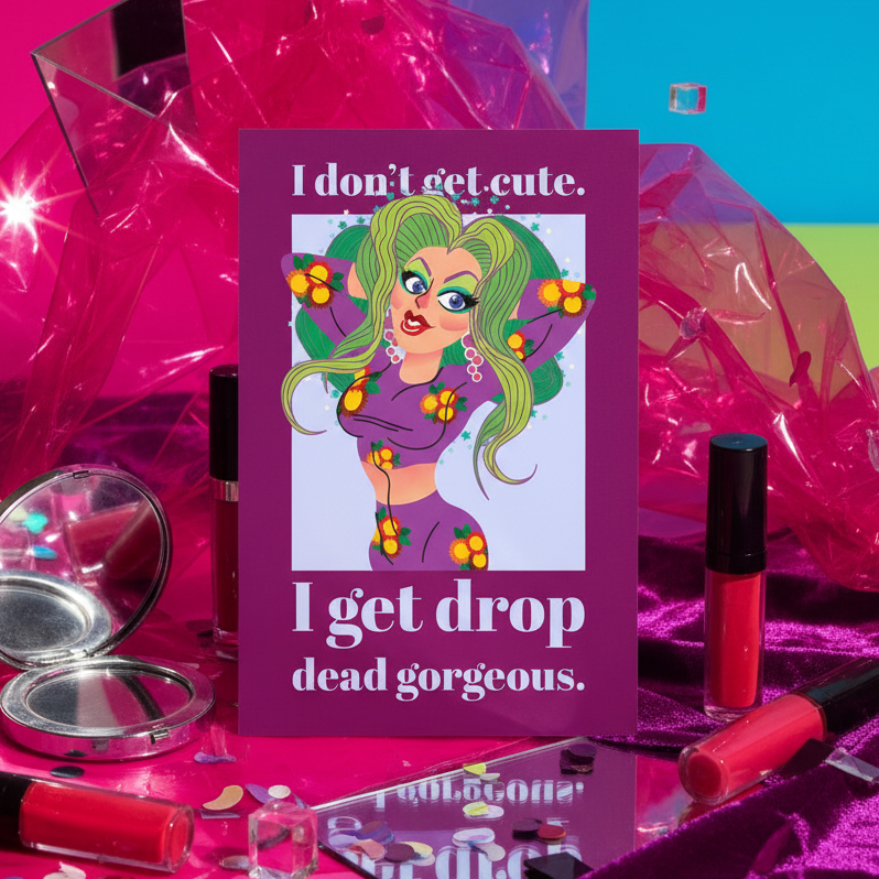 Postcard featuring a cartoon person with green hair, bold makeup, floral top, and the quote: I don't get cute