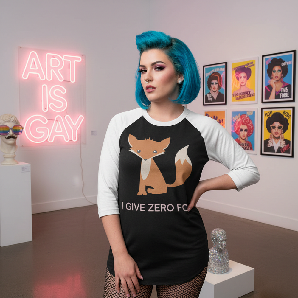 I Give Zero Fox 3/4 sleeve raglan tee with bold text and a cartoon fox, worn by a femme with vivid blue hair