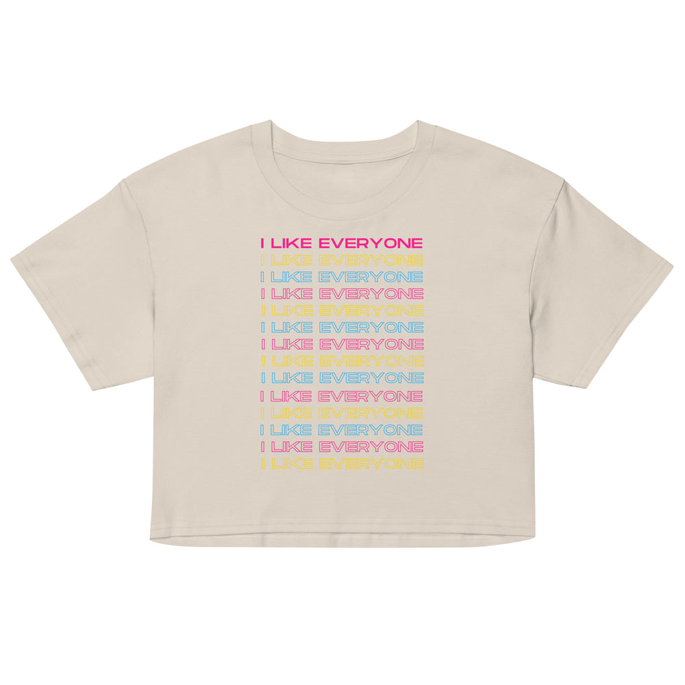 Front view of a cream crop top reading “I LIKE EVERYONE” in repeated colorful lines