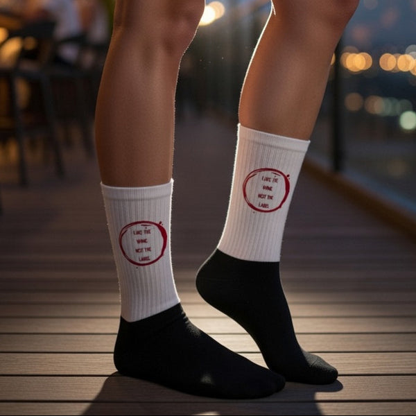 Pansexual pride socks with “I LIKE THE WINE NOT THE LABEL”, black toes and heels, red circle, cushioned soles