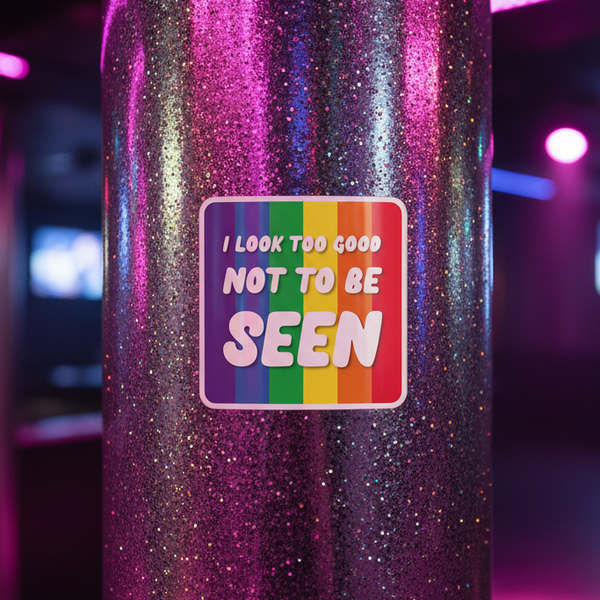 “I Look Too Good Bubble-Free Sticker” in bold, playful type is stuck to a glittery pole