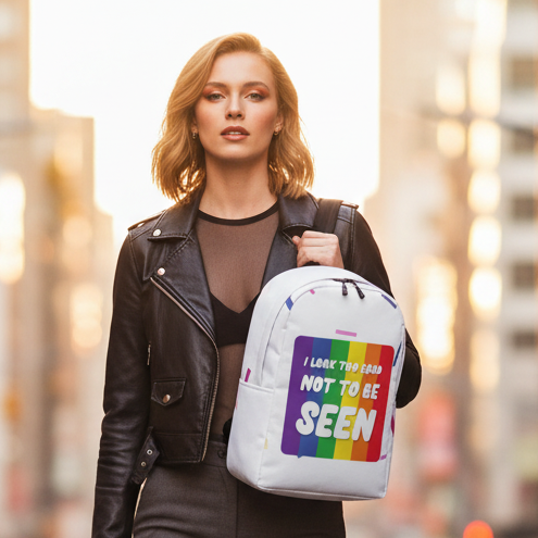 Minimalist backpack in white with rainbow stripes and "I look too fab not to be SEEN" slogan