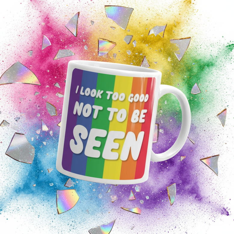 White mug angled right with rainbow stripes and the text “I LOOK TOO GOOD NOT TO BE SEEN”