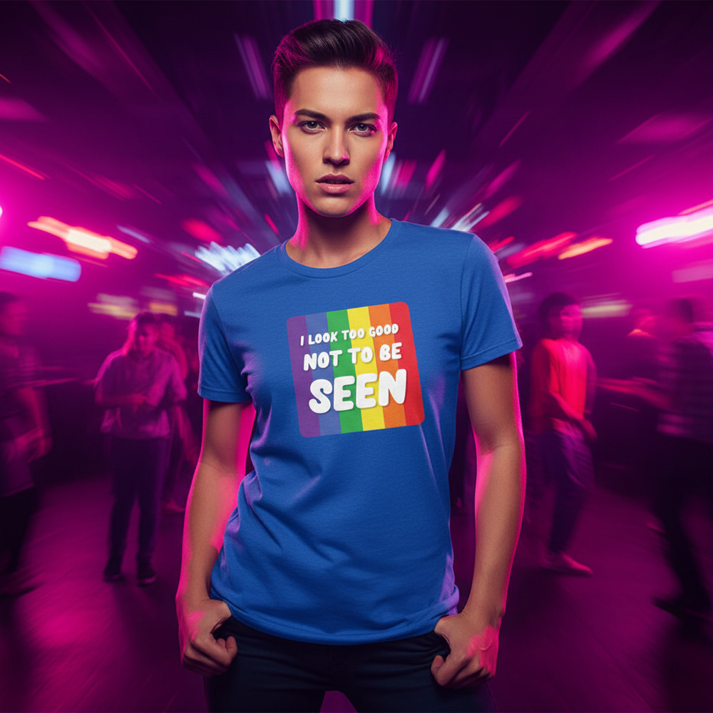 T-shirt with rainbow pride design and "I Look Too Good Not To Be Seen" slogan, worn by a person in neon-lit, vibrant room