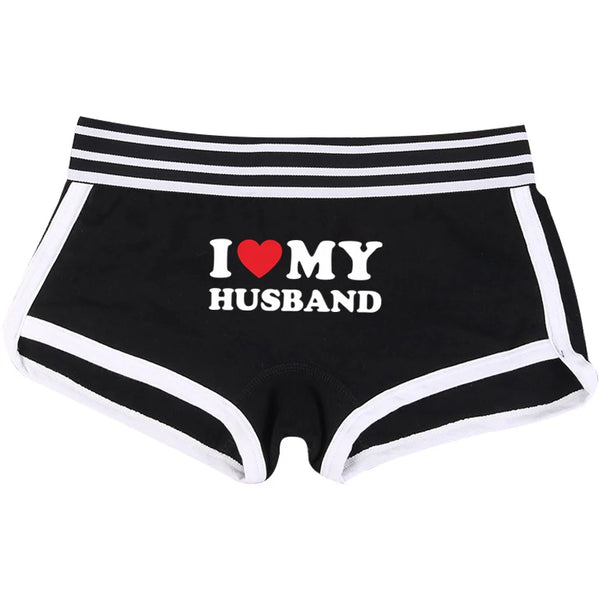 Front view of black boxer briefs with white trim and “I ♥ MY HUSBAND” lettering