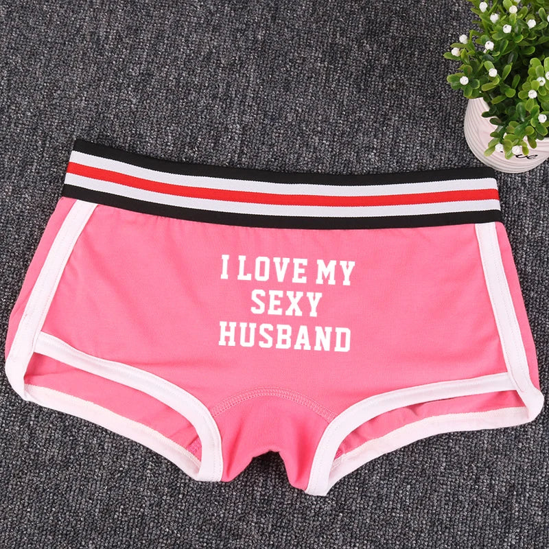 Pink boxer briefs with white trim and the words “I LOVE MY SEXY HUSBAND”