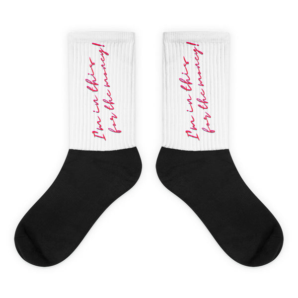 Pair of black socks with white ribbed cuffs reading “I’m in this for the money” in pink script
