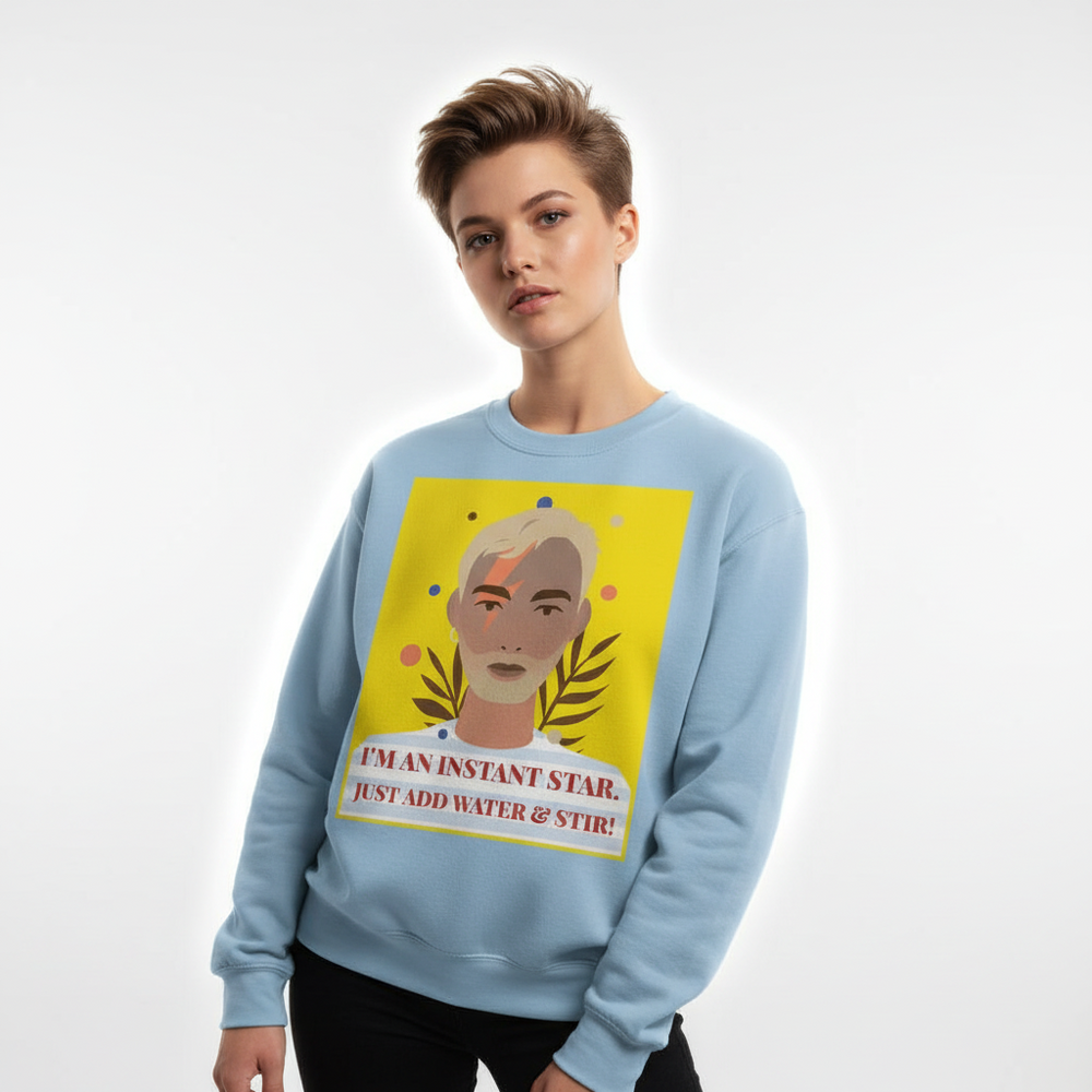 Model wearing a light blue sweatshirt with a pop-art portrait and “I'M AN INSTANT STAR” slogan