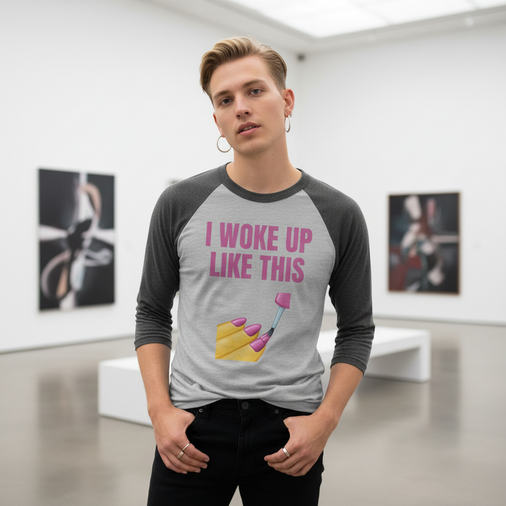 3/4 sleeve raglan shirt with "I Woke Up Like This" and a pink nail graphic, worn by a person with blond hair in a gallery