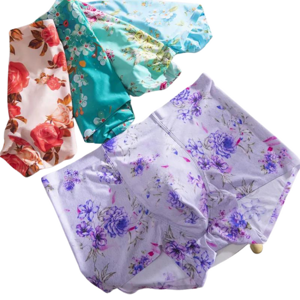 Flat lay of four floral-print ice silk boxer briefs in pastel colors