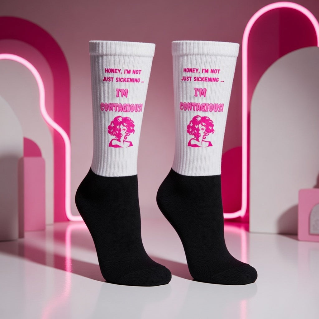 Pair of white-and-black crew socks reading “Honey, I’m not just sickening—I’m contagious!”