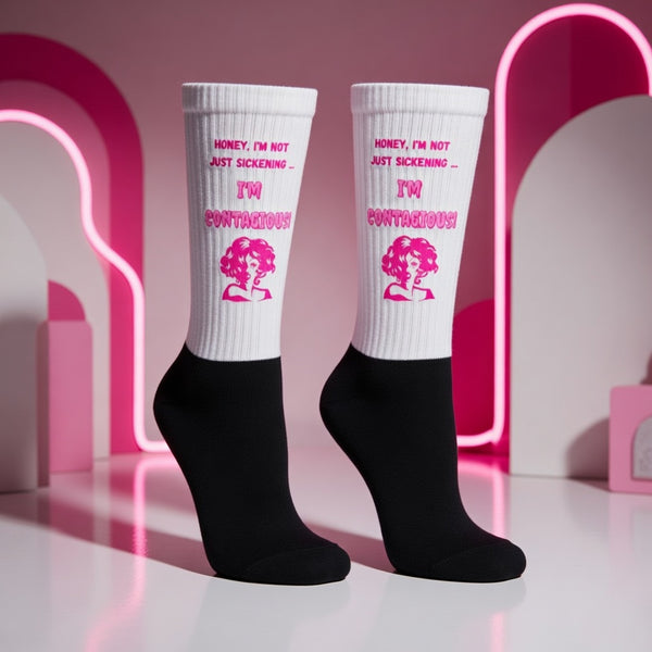 Pair of white-and-black crew socks reading “Honey, I’m not just sickening—I’m contagious!”