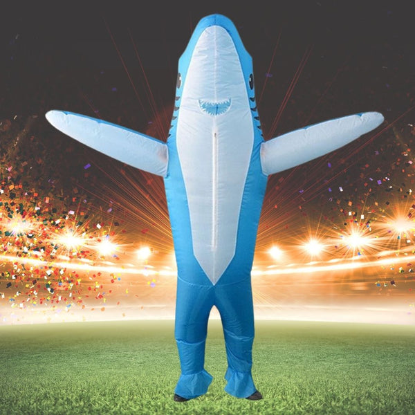 Inflatable blue shark costume with outstretched fins on a confetti-filled field