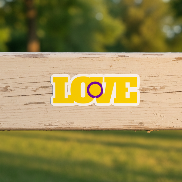 Bubble-free sticker says “LOVE” in bold yellow vinyl; the “O” is a purple intersex ring