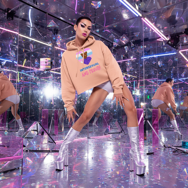 Intersexual And Proud crop hoodie paired with white shorts, silver platform boots, bold makeup