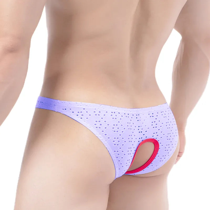 Rear view of a model wearing lavender perforated panties with a red-trimmed open crotch