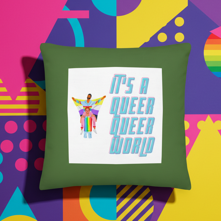 It's A Queer Queer World Pillow with three people in rainbow outfits and bold text on a white square