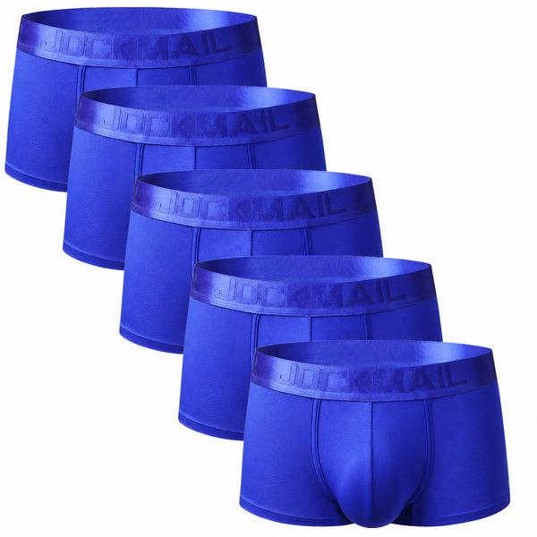 Five royal-blue Jockmail boxer briefs arranged diagonally on a white background