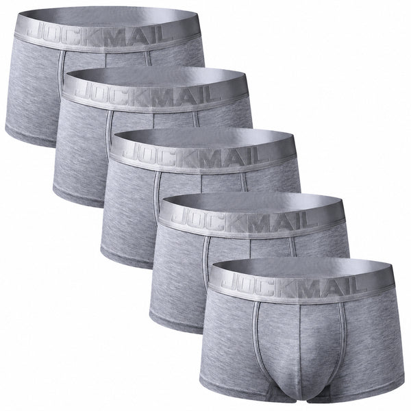 Five gray Jockmail boxer briefs arranged diagonally, showing branded waistbands and front pouches