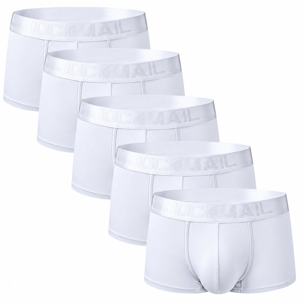 underwear for bears: Shirtless, muscular person with shaved head and beard models Jockmail Classic Boxers (5 Pack) by a dark