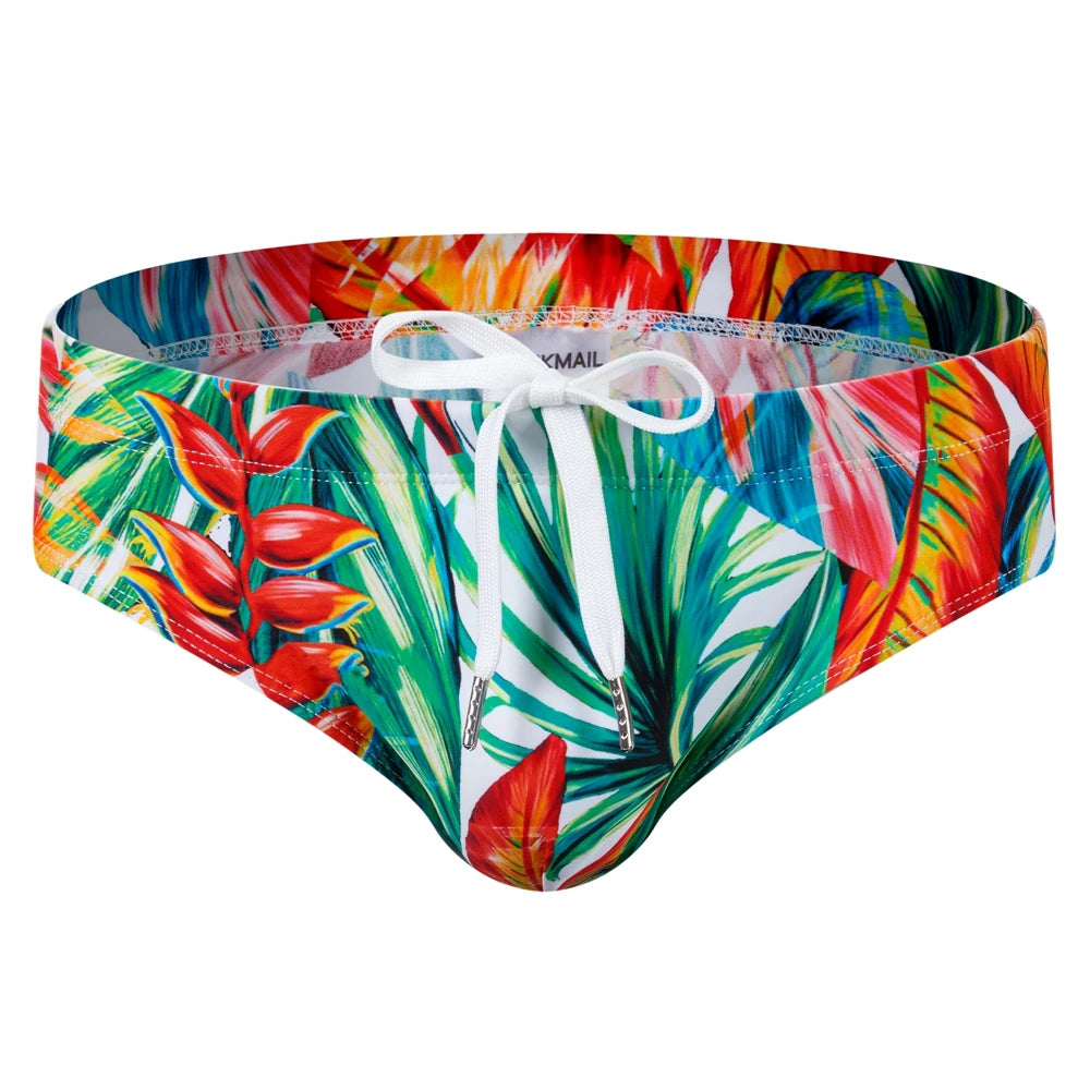 Front view of colorful tropical-print swim trunks with a white drawstring