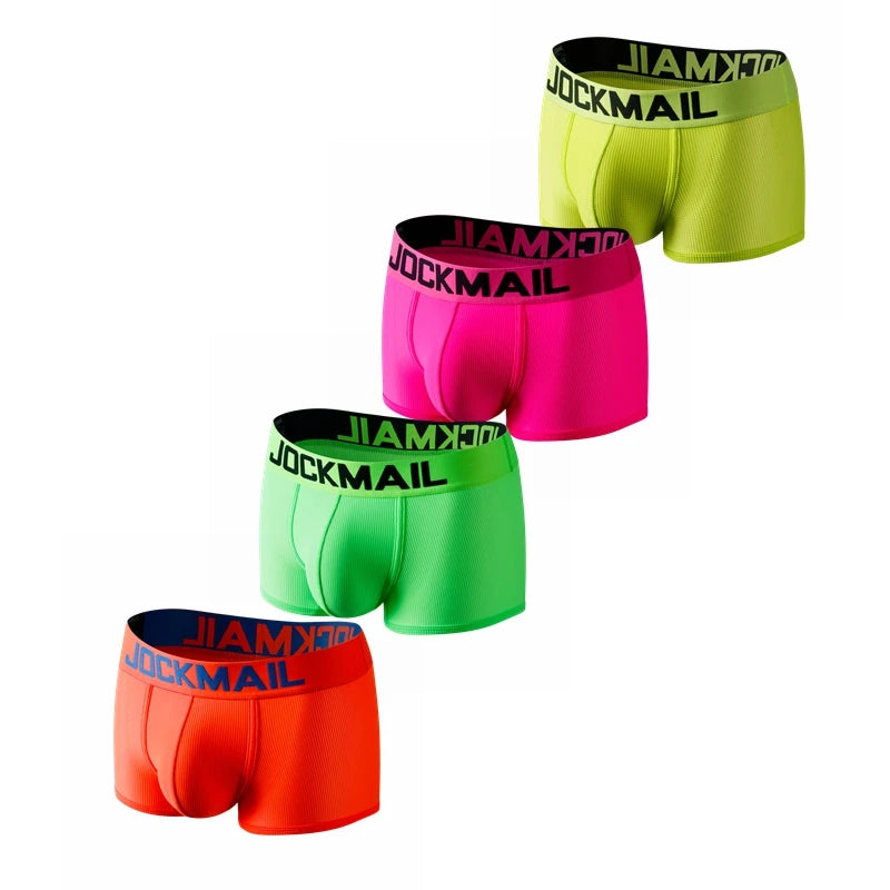 Four bright neon boxer briefs arranged diagonally, each with a black JOCKMAIL waistband