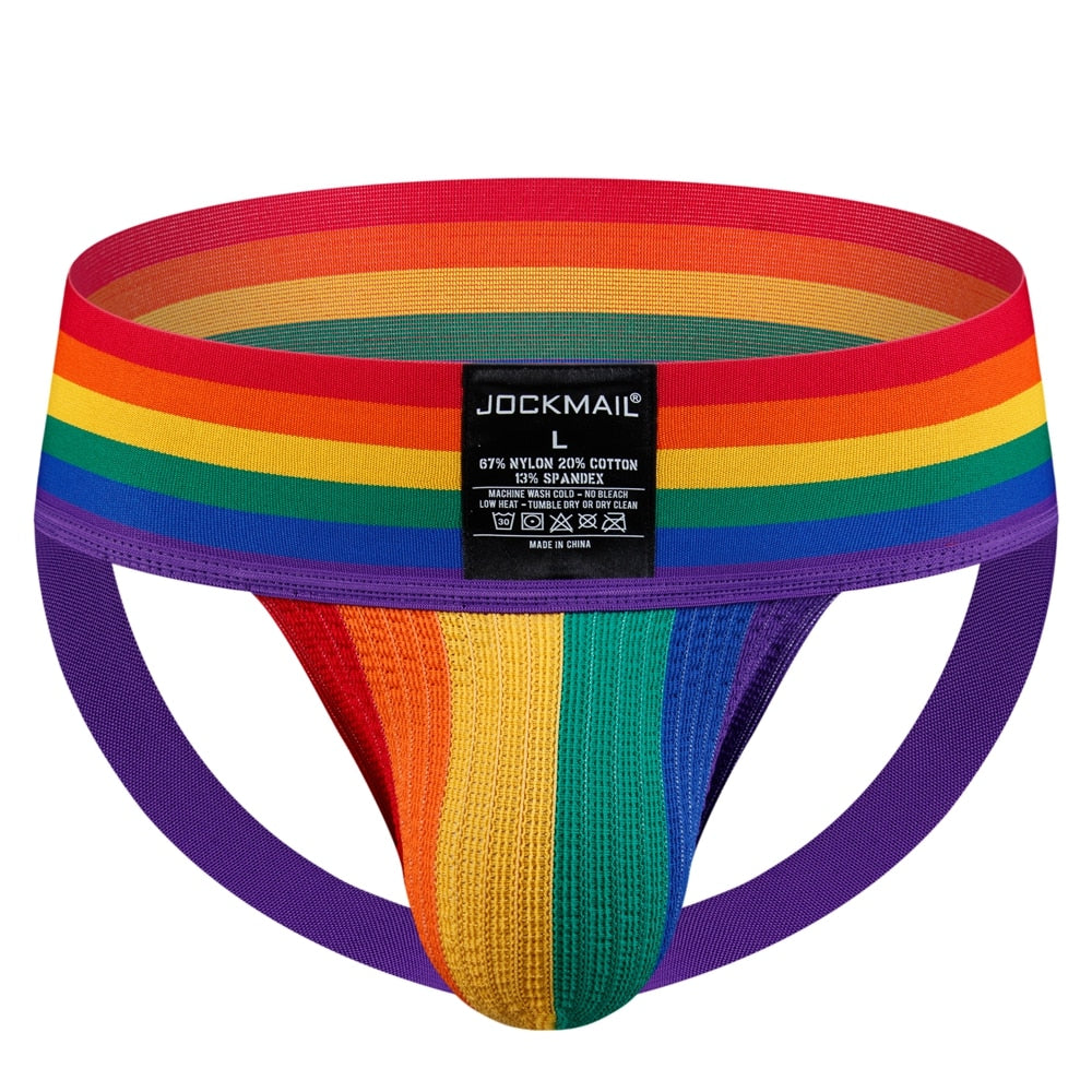Front view of a rainbow-striped jockstrap with a wide waistband and purple leg straps