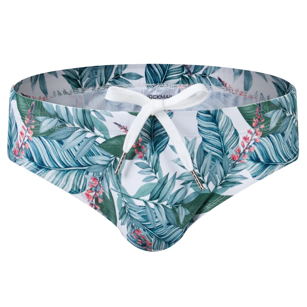 Front view of tropical leaf-print swim briefs with a white drawstring waistband