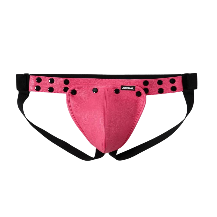 Shirtless, muscular model wears Jockmail Athletic Kink "Big Bulge" Jockstrap in bright pink leather with black studs; face unseen.