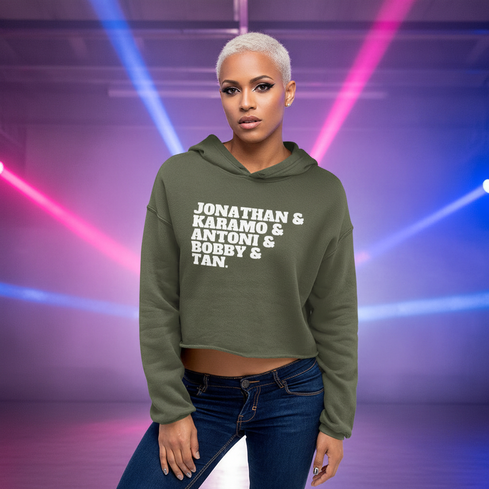 Crop hoodie in olive with “Jonathan & Karamo & Antoni & Bobby & Tan” text, worn by a confident queer person, platinum hair.