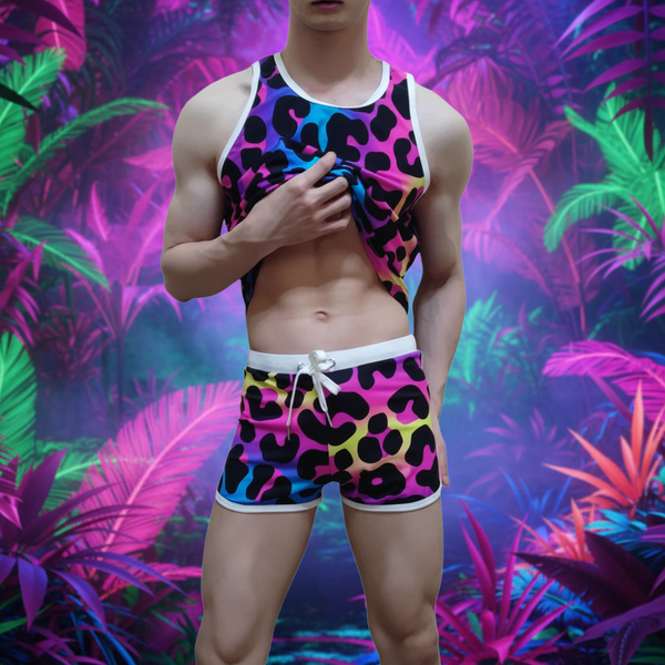 Cropped model lifting a colorful leopard-print tank top above matching drawstring shorts