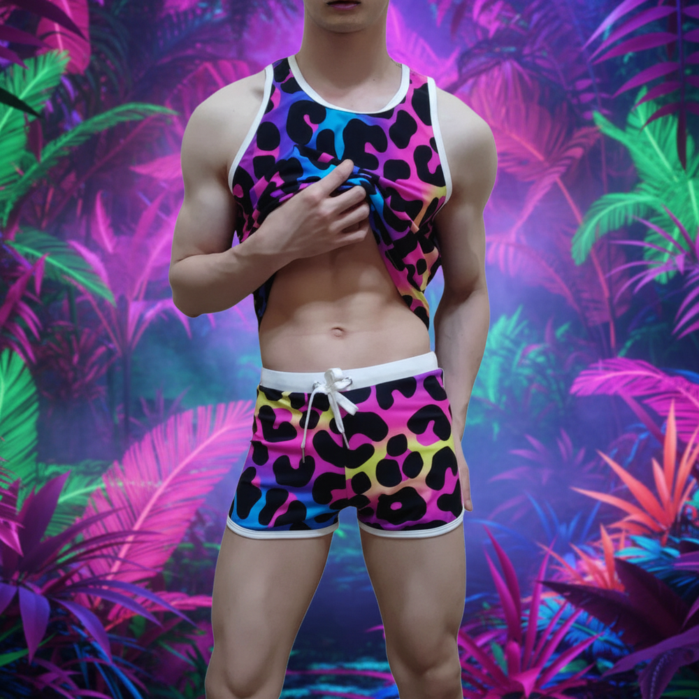 Cropped model lifting a colorful leopard-print tank top above matching drawstring shorts