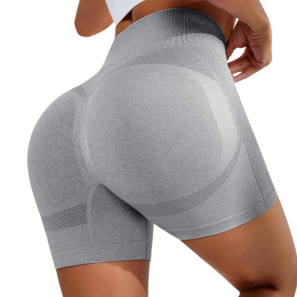 Rear close-up of a person wearing gray high-waisted, seamless compression shorts