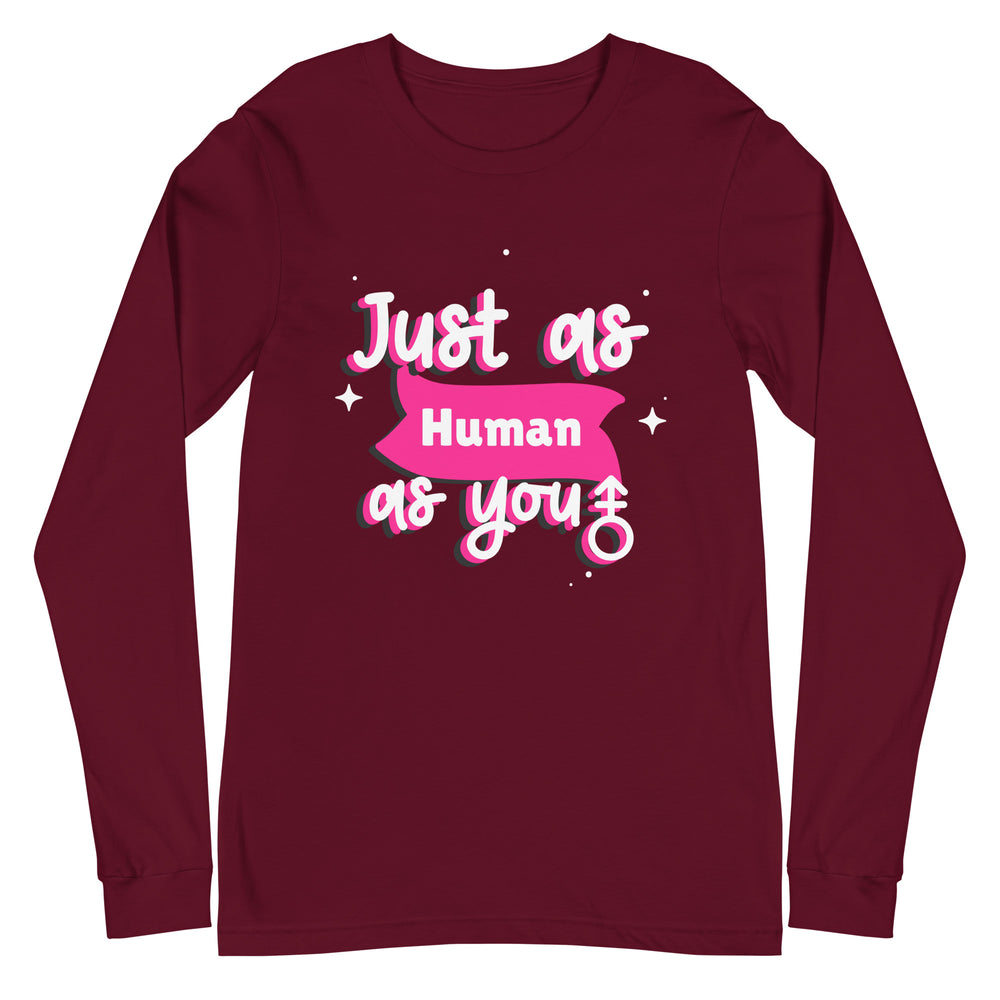 Unisex long sleeve tee with bold white, pink, and blue text reading "Just As Human As You," playful fonts, stars