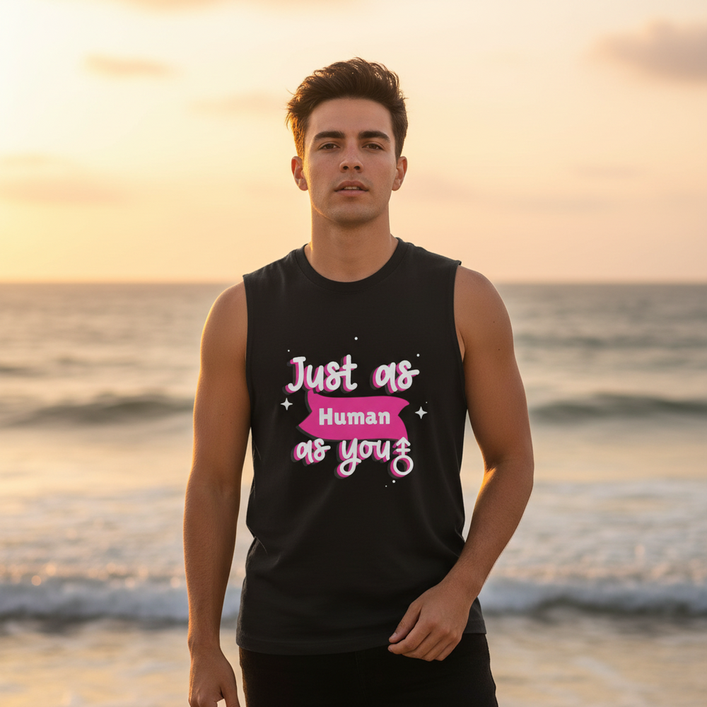 Front-facing person wears a black muscle tank reading “Just as Human as you” at sunset beach