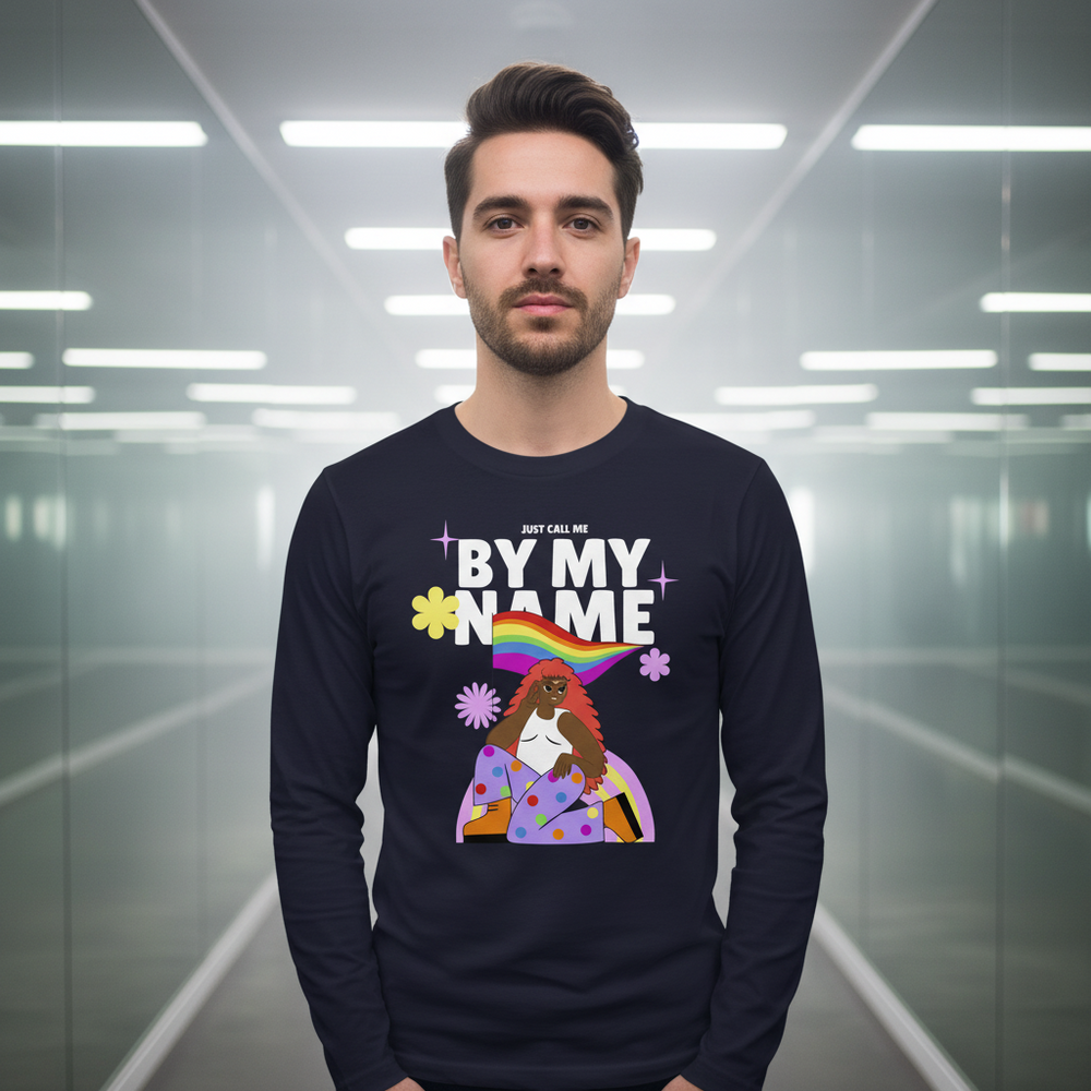 Front view of a person wearing a dark long-sleeve shirt reading “JUST CALL ME BY MY NAME” with a rainbow graphic.