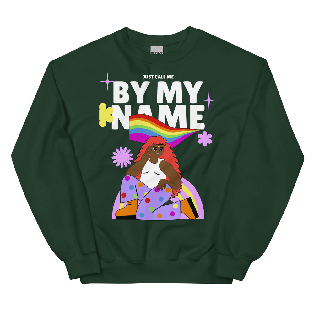 Dark green unisex sweatshirt with "Just call me BY MY NAME," rainbow, flowers, and a brown-skinned person rocking red hair.