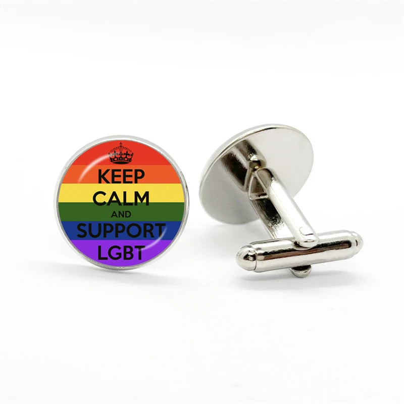 Pair of rainbow cufflinks, one reading “KEEP CALM AND SUPPORT LGBT,” one showing its silver backing