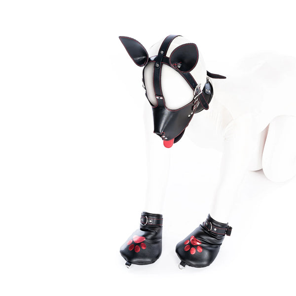 Front view of a person in a black pup hood and matching paw-print boot covers